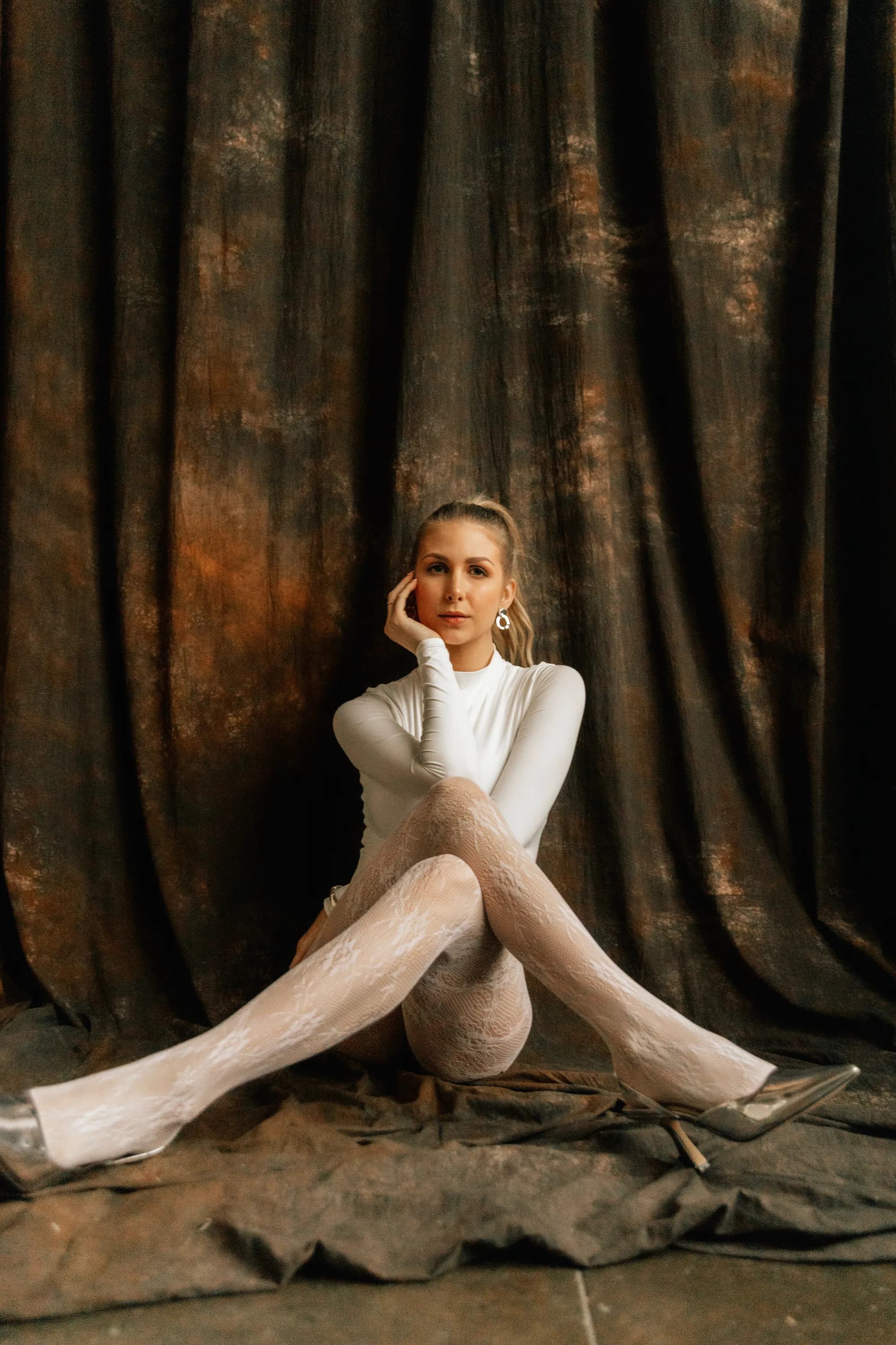 White bodysuit on drape